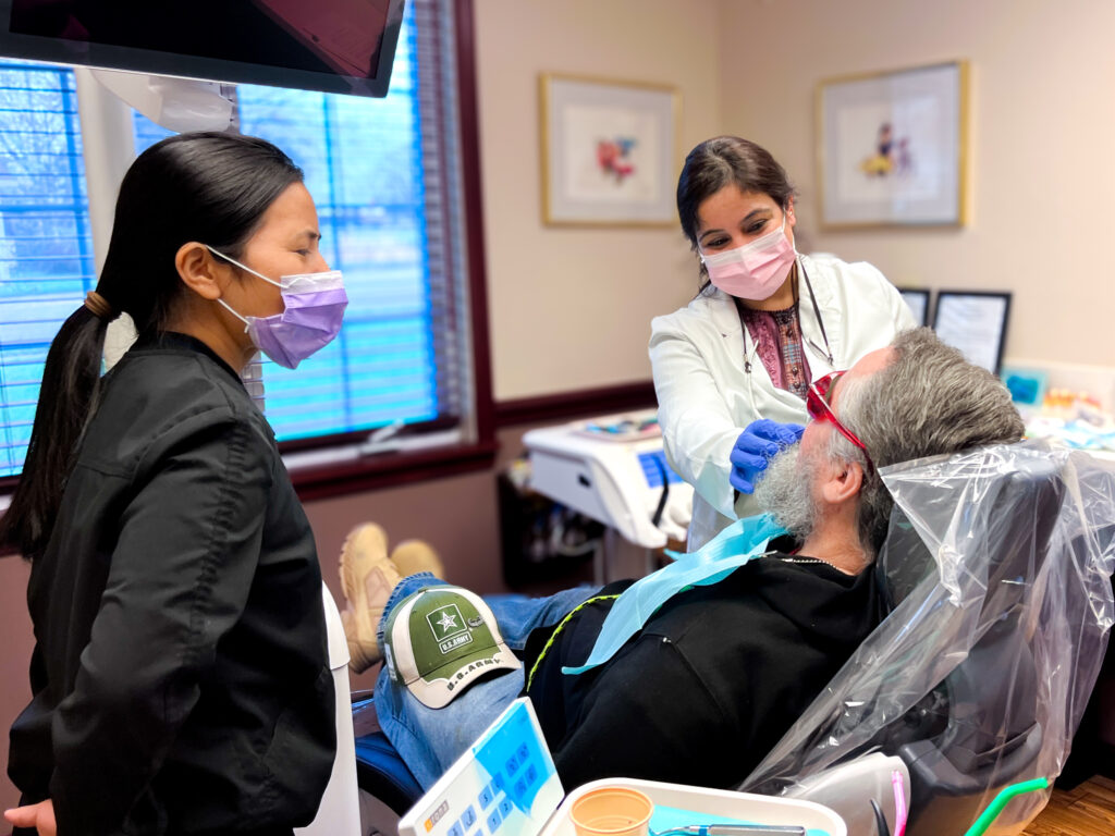 Dr. Payal Singh and dental assistant providing emergency dental care at Parkview Dental in New Whiteland, Indiana