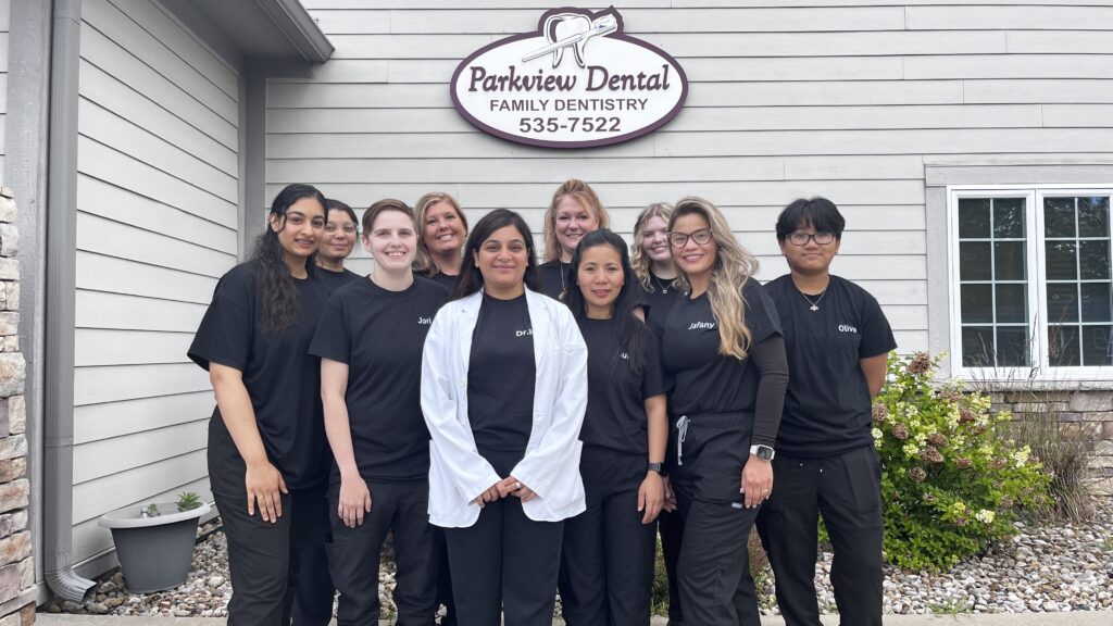 Dr. Payal and the Parkview Dental team standing outside the office in New Whiteland, IN